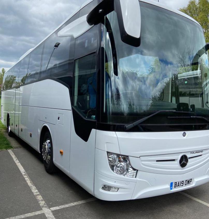 White coach bus parked outdoors